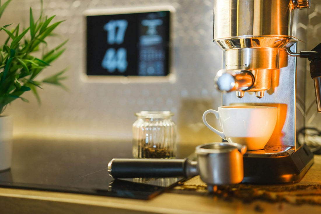 Espresso machine brewing coffee into a white cup with coffee beans and a clock in the background.