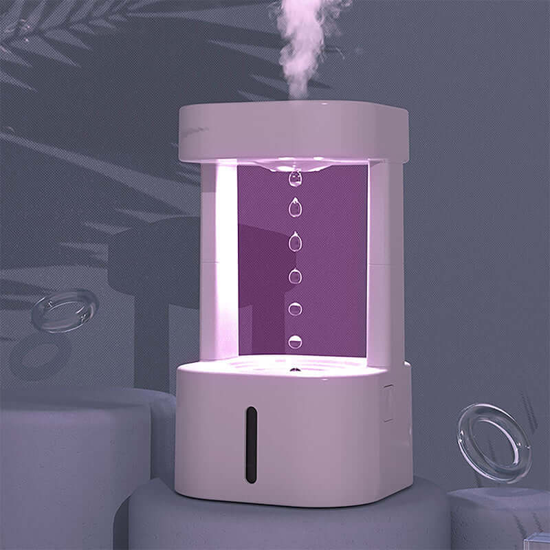 Creative anti-gravity water drop humidifier with mist spray, stylish design, and 580ML water tank for home or office use.
