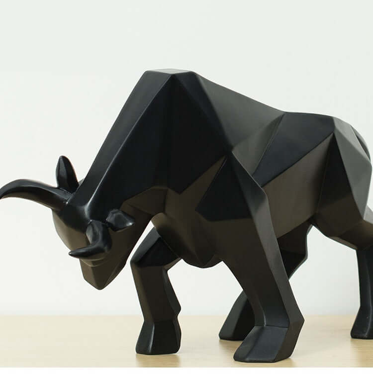 Geometric black resin bull sculpture highlighting modern decor for home and office, perfect for art lovers and gifts.