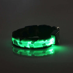 Camouflage luminous dog collar with green LED lights, made of durable nylon and plastic for nighttime visibility.