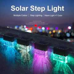 Colorful RGB solar step lights providing warm glow and decorative lighting for gardens and outdoor spaces at night.