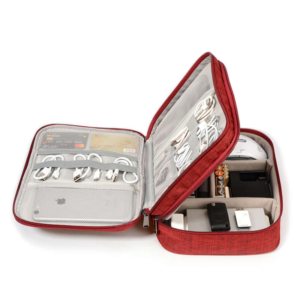 Red cable organizer bag open with electronic accessories: chargers, cables, and devices neatly stored inside.