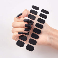 Pure Color 16 black nail stickers displayed on a hand with polished nails, showcasing a stylish nail art design.
