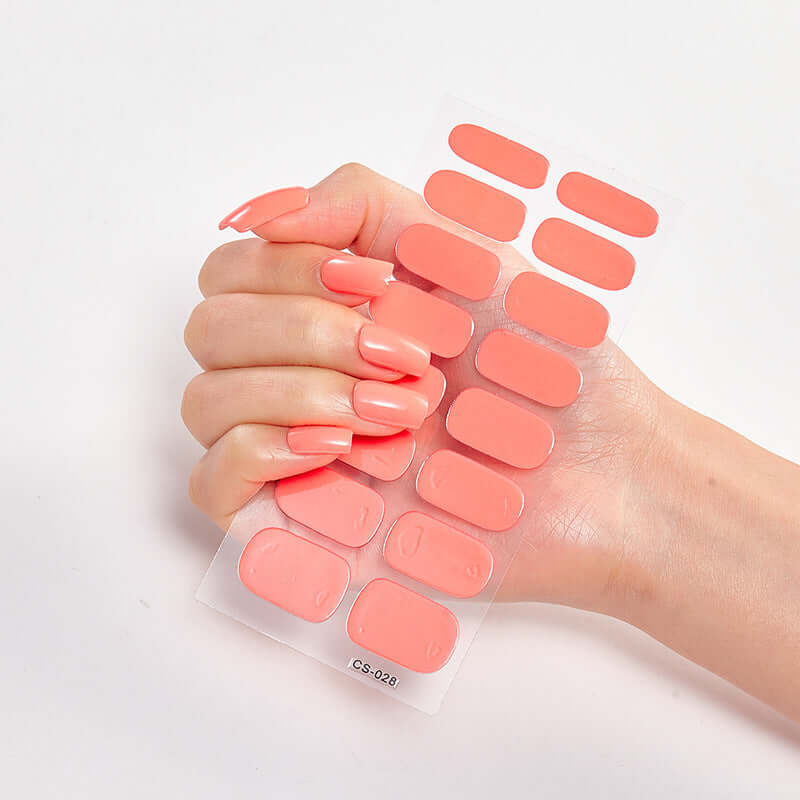 Pure Color 16 nail stickers in hand showcasing vibrant pink shades, environmentally friendly resin ink, CS-028