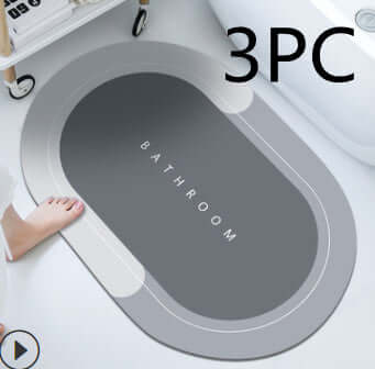 Modern oval bathroom mat in dark gray with anti-slip rubber backing, designed for quick-drying and absorbent functionality.