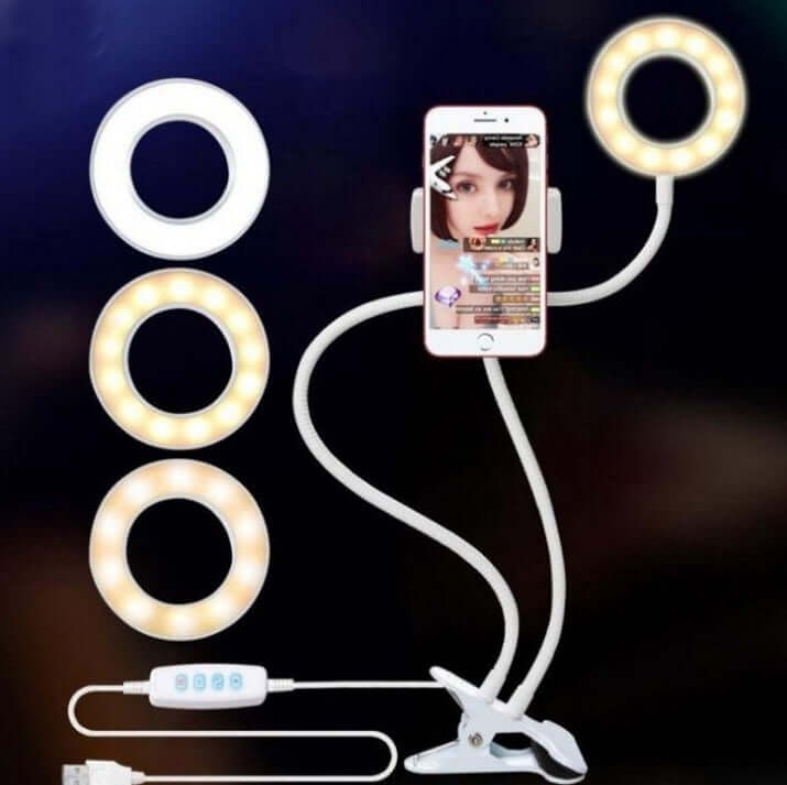 LED selfie ring light with adjustable colors and brightness, featuring a phone holder for makeup and live streaming.