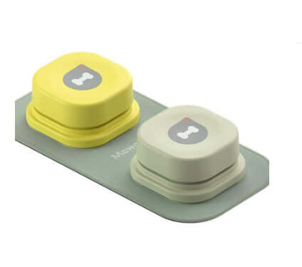 Two pet communication buttons in yellow and gray on a base, designed for recording pet sounds and commands.