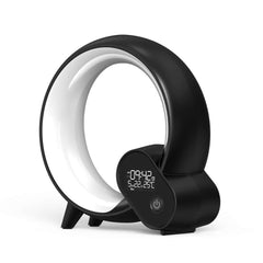 Creative Q Light Alarm Clock in modern black design with LED display and unique circular shape.