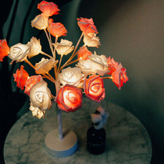  Rose flower lamps in pink and white on a marble table with soft lighting, ideal for elegant home decor.