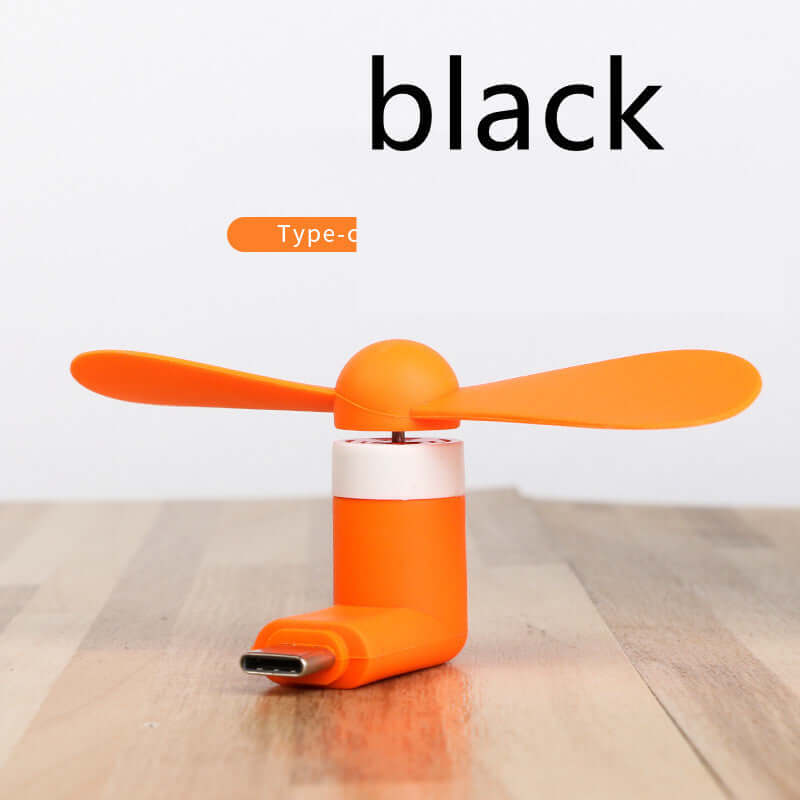 Mobile mini fan in orange color, lightweight, USB compatible, ideal for phones, low noise for a breezy experience.