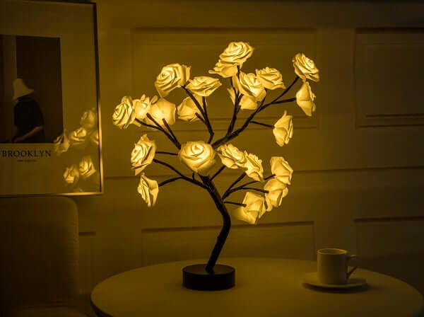  Rose flower lamps in pink and white on a marble table with soft lighting, ideal for elegant home decor.