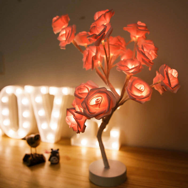  Rose flower lamps in pink and white on a marble table with soft lighting, ideal for elegant home decor.