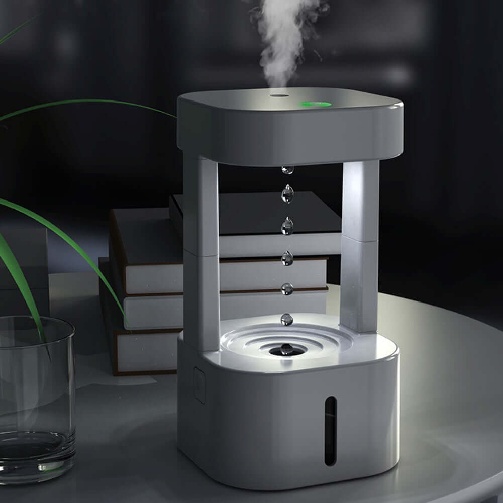 Creative anti-gravity humidifier with mist spray, showcasing water droplets flowing upward in a stylish design.
