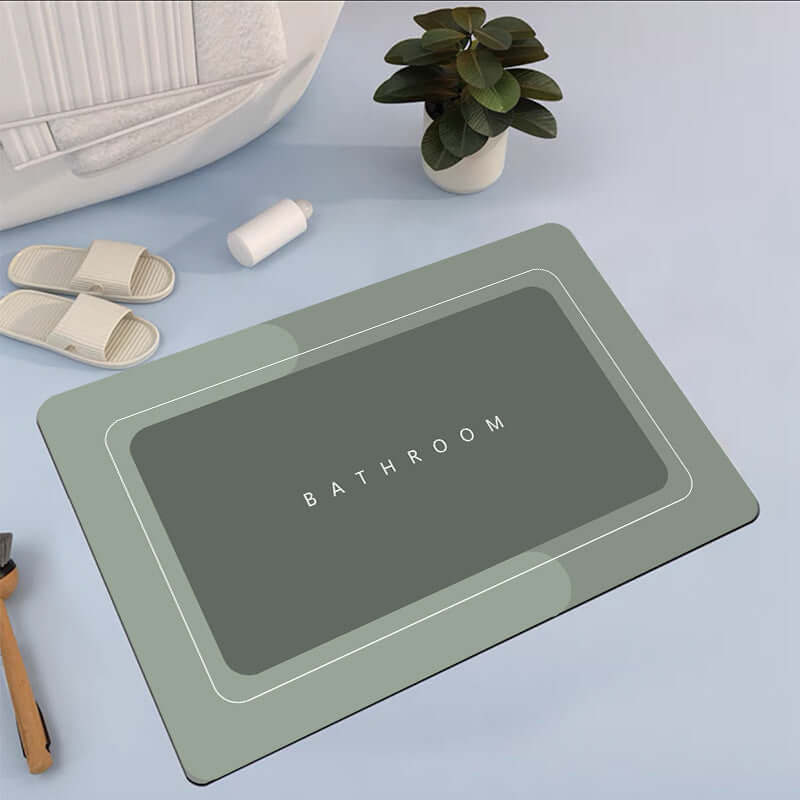 Modern rectangular bathroom mat in elegant gray color with 'BATHROOM' text, ideal for quick-drying and absorbency.
