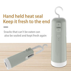 Handheld vacuum sealer for snacks, featuring a heat seal function to keep food fresh and minimize waste.