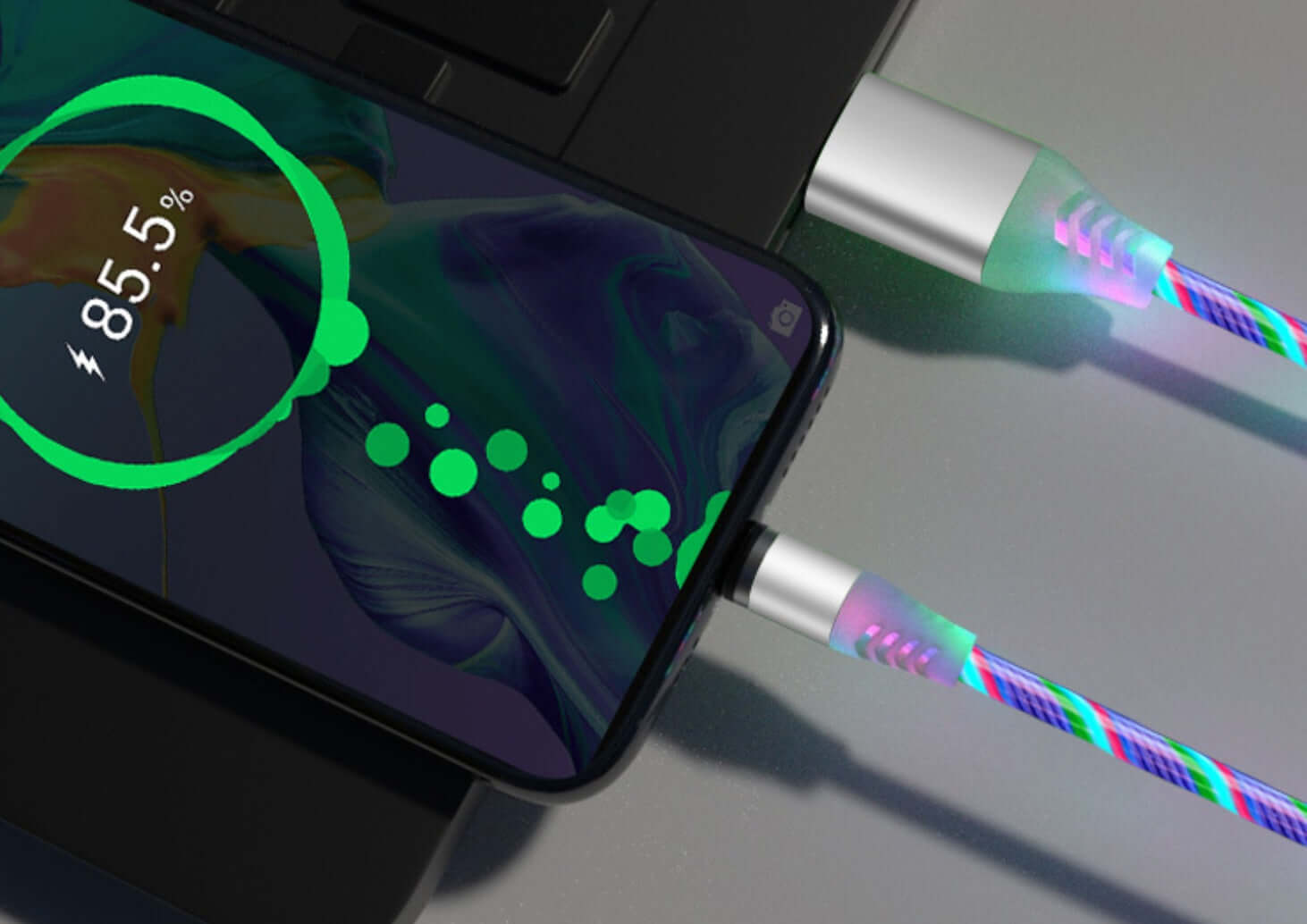 Colorful magnetic streamer data cable charging an iPhone, showing battery level at 85.5% with sleek design.