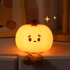 Cute soft silicone pumpkin night light for kids, dimmable and rechargeable bedside decor for Halloween.