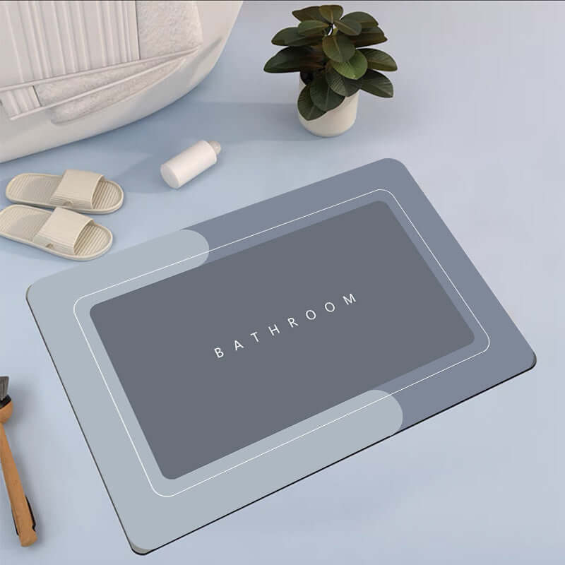 Modern bathroom floor mat in gray with 'BATHROOM' text, designed for absorbency and quick-drying.