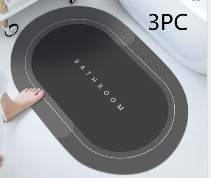 Modern oval bathroom mat with gray design, featuring the word 'BATHROOM', perfect for quick-drying and absorbent functionality.