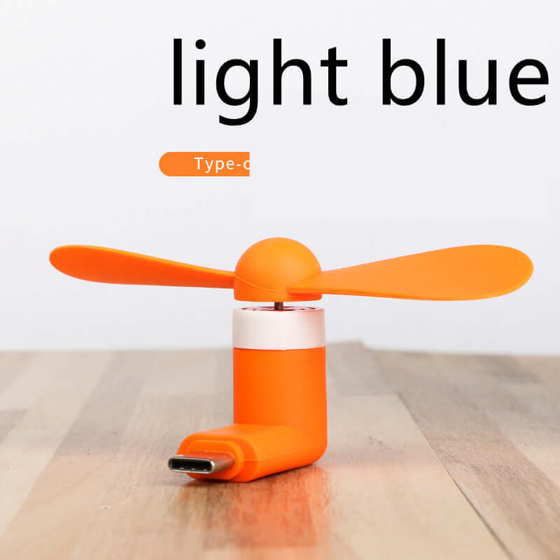 Compact orange mobile mini fan for smartphones, ideal for cooling on-the-go, compatible with iPhone/Android.