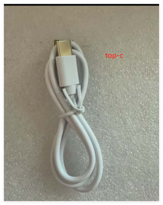 White USB Type-C charging cable, coiled, with a metallic connector end on a light background.