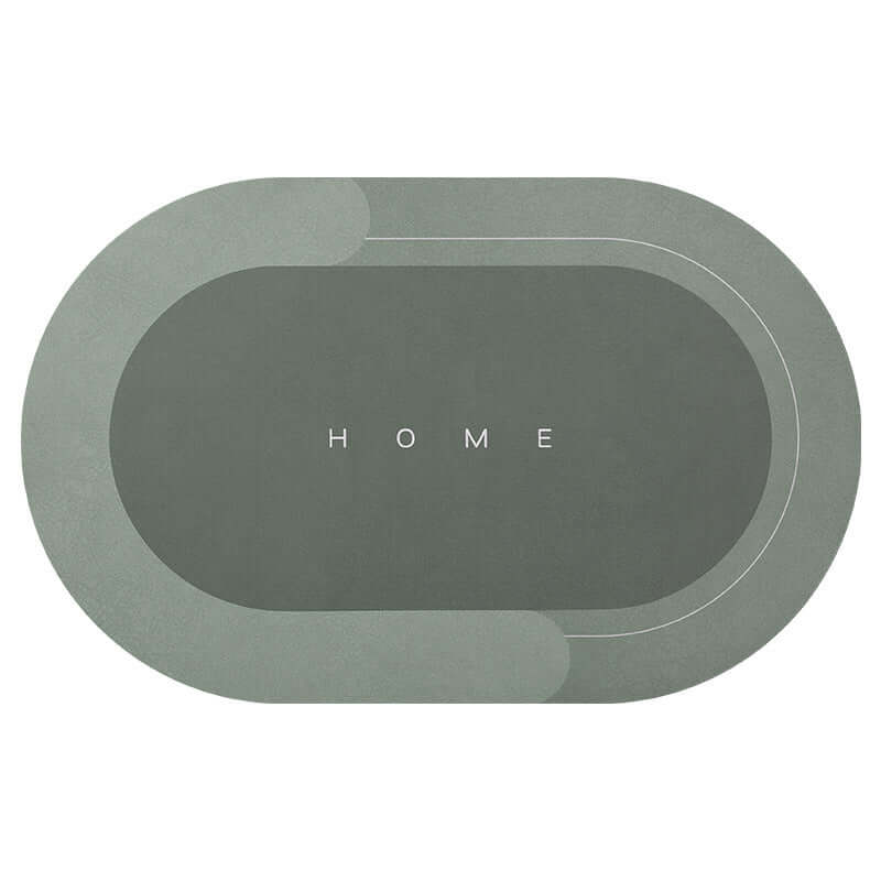 Oval modern bathroom mat in elegant gray with 'HOME' text, quick-drying and absorbent for home use.