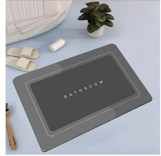 Modern gray bathroom absorbent mat with 'BATHROOM' text, perfect for quick-drying and enhancing home decor.