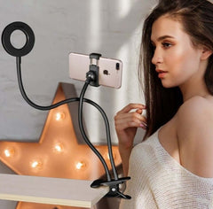 Lady using LED selfie ring light with smartphone clamp for adjustable makeup lighting
