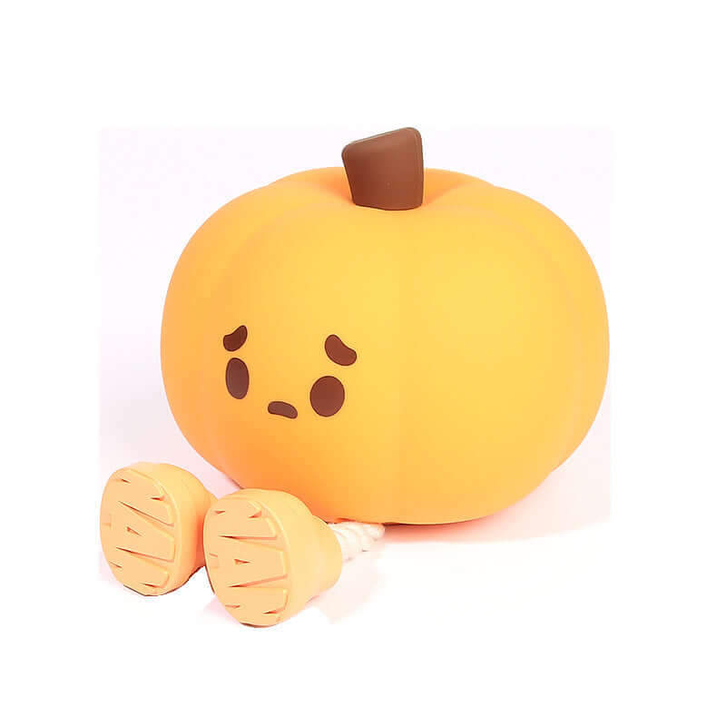 Cute silicone pumpkin night light with sad expression, dimmable and rechargeable for kids' room decor.