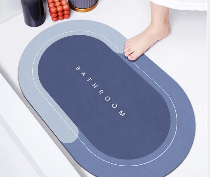 Modern oval bathroom mat in Baikal blue, featuring absorbent and quick-drying material.