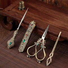 Affordable Luxury Inlaid With Phoenix Tail Scissors Set featuring ornate gold scissors and accessories.