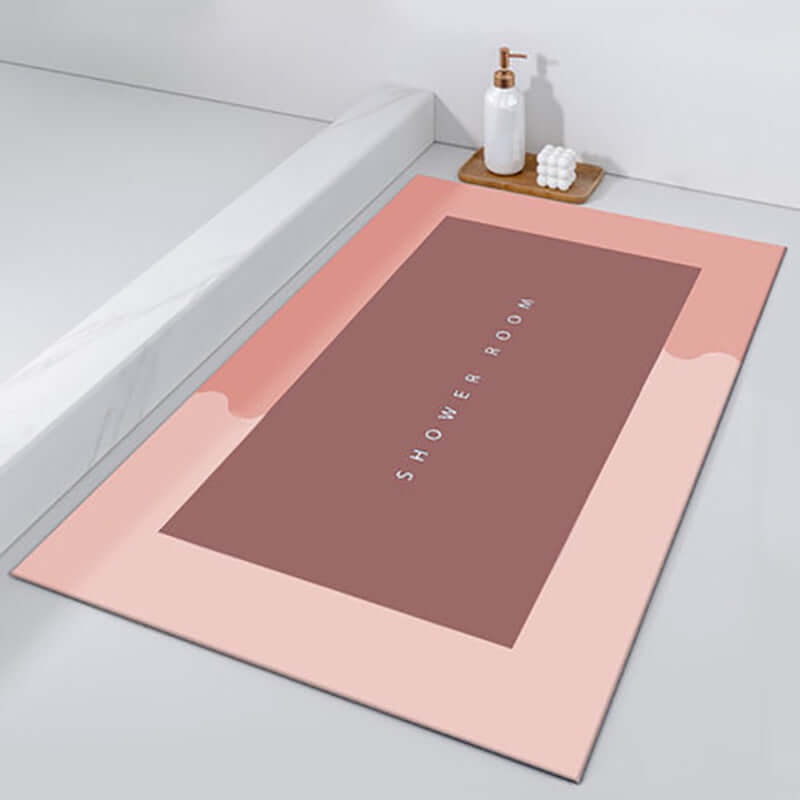 Modern shower room mat in soft pink with a stylish design, ideal for quick drying and absorbency.