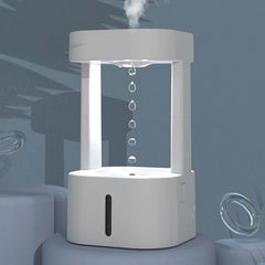 Creative anti-gravity humidifier with mist spray and water droplets, ideal for bedroom and office use.