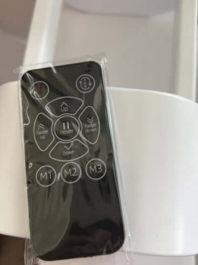 Remote control for desert air conditioner with buttons for speed and settings, designed for user convenience.