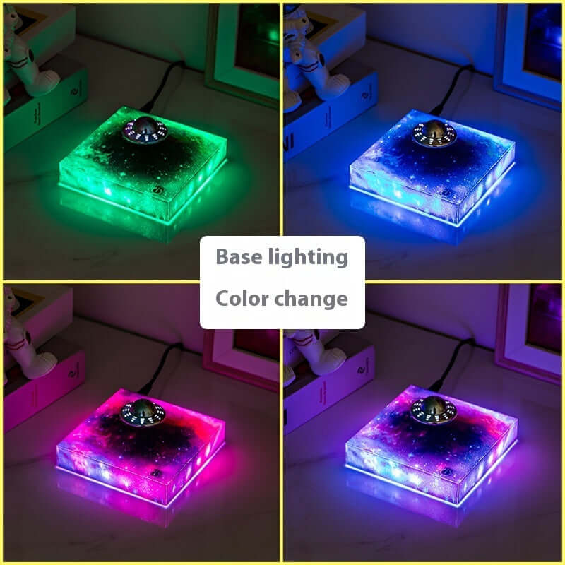 Levitating UFO Color Galaxy Lamp with color-changing lights showcasing green, blue, and pink hues in a creative decor setting.