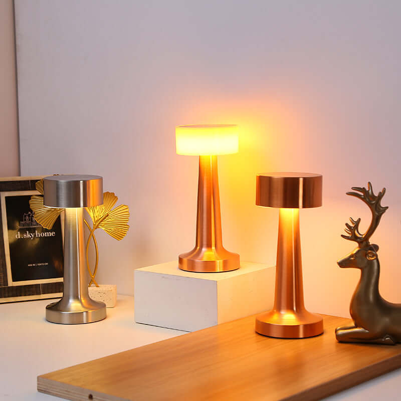Modern rose gold metal table lamp with dimming feature