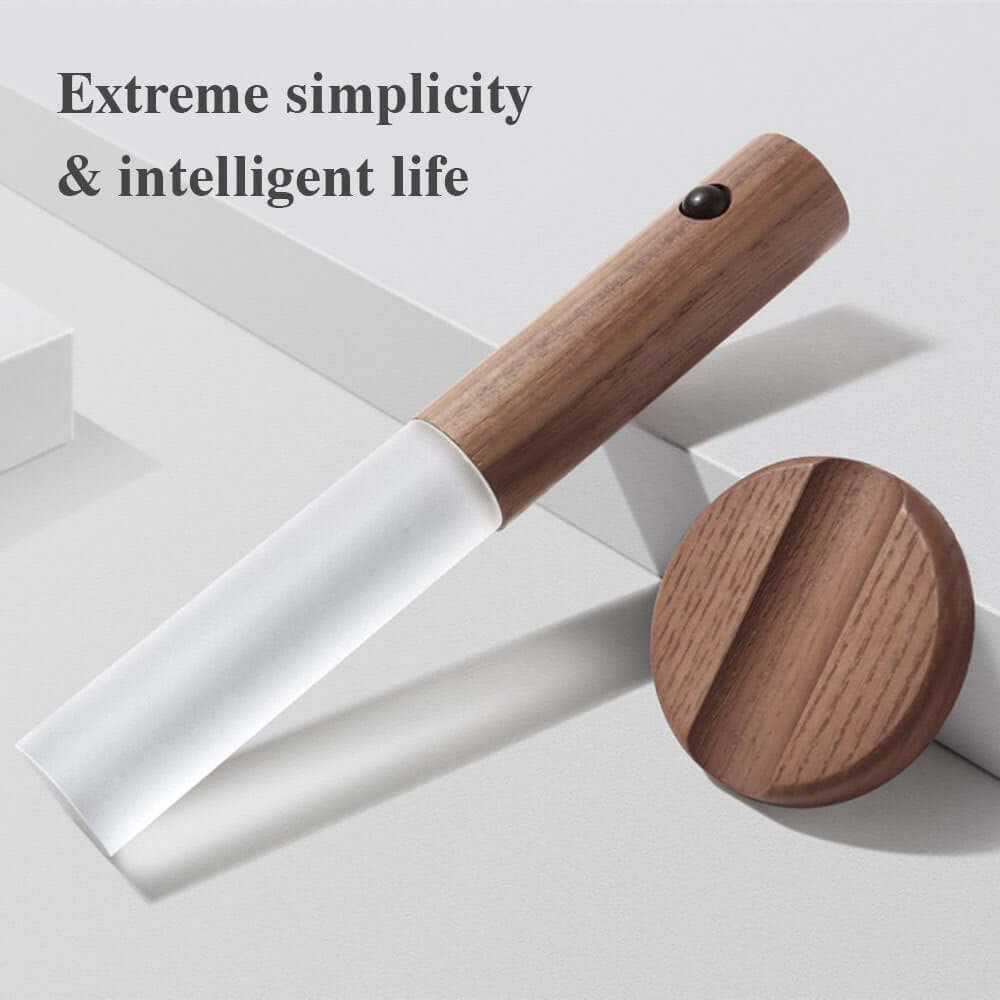 Wireless LED night light with wood handle, showcasing modern simplicity and functionality.