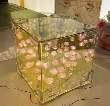 Handmade DIY Rubik's Cube Tulip night light showcasing pink flowers in a stylish yellow casing for home decor.