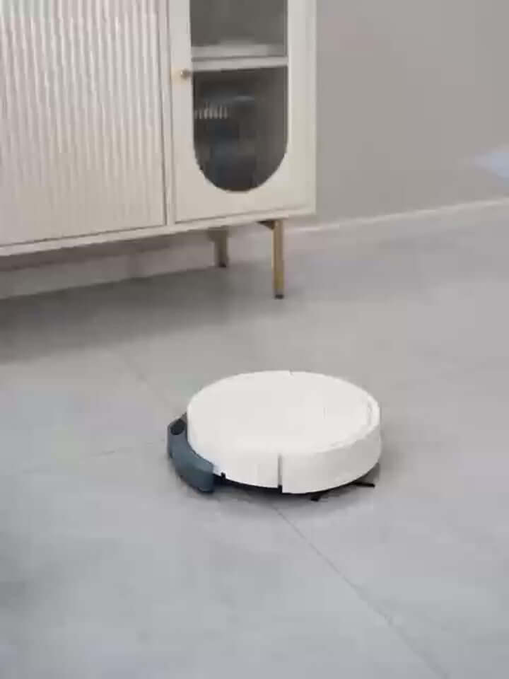 Intelligent sweeping robot in a modern living room, featuring a large water tank and remote control capability for efficient cleaning.