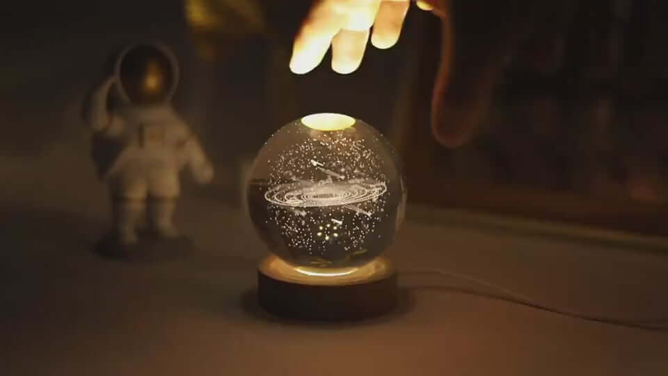 The Luminous Galaxy Crystal Ball features 3D laser-carved galaxies for a magical decor piece that glows—ideal for gifts, desks, or nightstands.