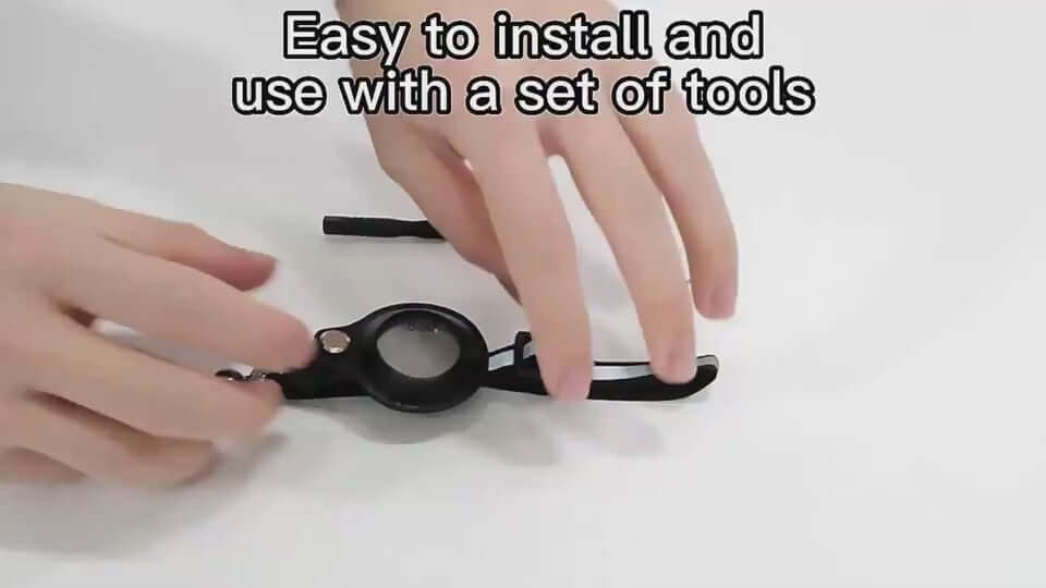 Hands demonstrating installation of a reflective collar holder for Airtag, showcasing ease of use with tools.