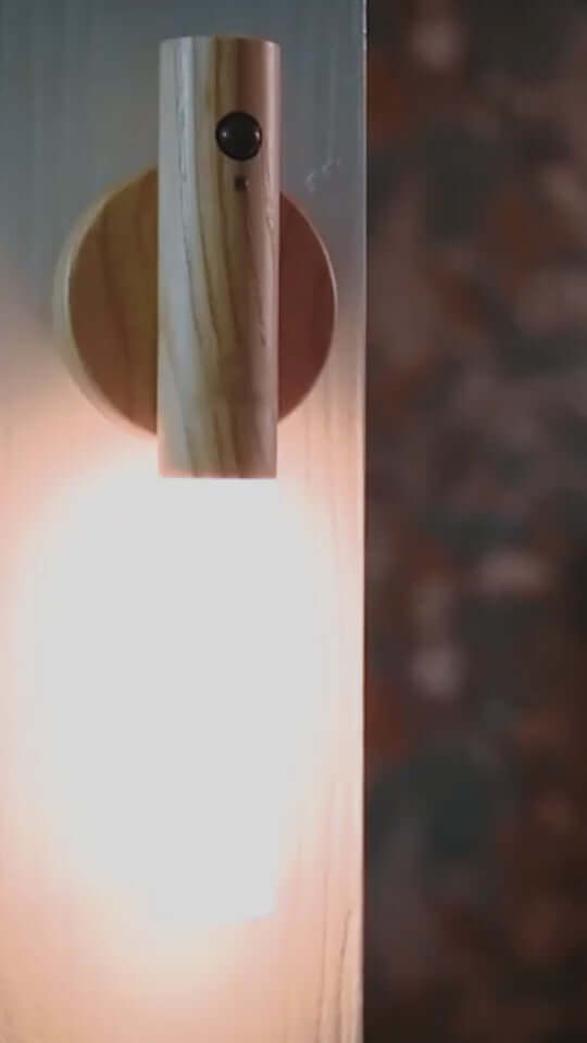 Wooden LED wireless night light with PIR motion sensor, showcasing soft warm light and magnetic design.