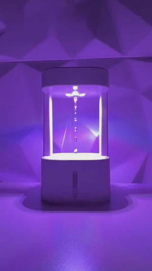 Anti-gravity humidifier with colorful lighting and mist spray, ideal for home or office use.