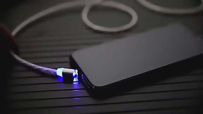 Magnetic streaming data cable connected to smartphone, featuring blue LED light and a sleek design for easy charging.