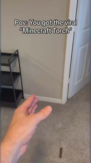 Hand reaching for a viral Minecraft torch, showcasing a playful indoor scene.